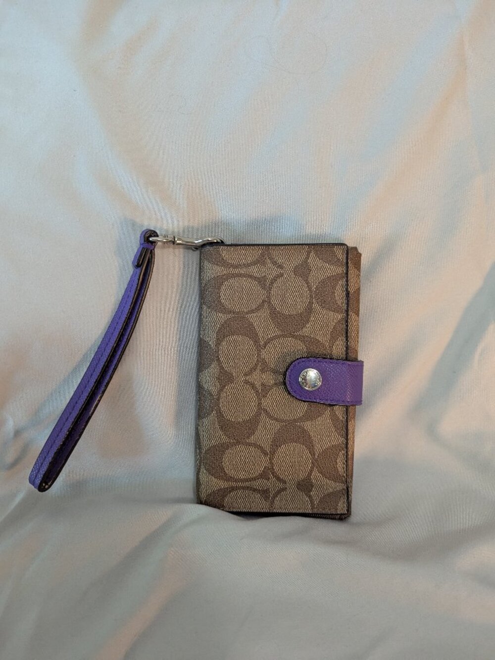 COACH brown and purple wristlet wallet